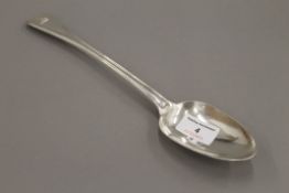 A silver basting spoon. 30.5 cm long. 169.6 grammes.