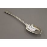 A silver basting spoon. 30.5 cm long. 169.6 grammes.