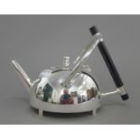 A Christopher Dresser style teapot. 15 cm high.
