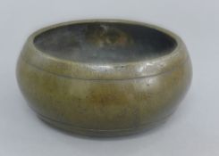 A Chinese bronze censer. 15 cm diameter.