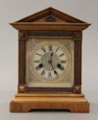 A Victorian walnut mantle clock. 32.5 cm high.