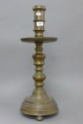 An early Dutch bronze candlestick. 59 cm high.