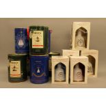 A collection of twelve boxed and full Wade Bells Scotch Whiskey decanters,