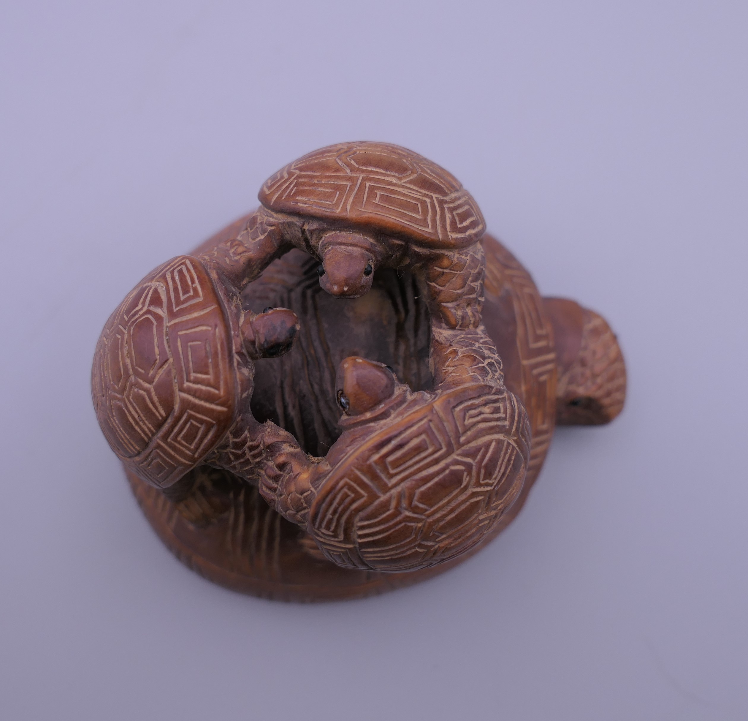 A Japanese carved wooden tortoise group. 6.5 cm high. - Image 2 of 3