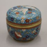 A 19th century Chinese blue ground cloisonne box and cover, the lid decorated with flying cranes. 6.