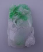 A two tone jade pendant. 5.5 cm high.