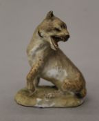 A small 19th century Meissen porcelain model of a wild cat. 6.5 cm high.