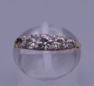 A gold diamond set ring (one stone lacking). Ring size J/K.