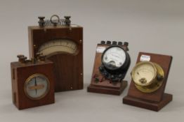 Four vintage ampere meters. The largest 20 cm high.