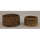 A Victorian treen pint measure and a Victorian treen half pint measure. The former 12.5 cm diameter.