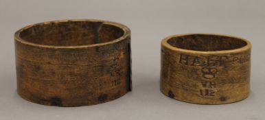 A Victorian treen pint measure and a Victorian treen half pint measure. The former 12.5 cm diameter.