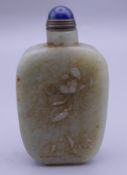 A Chinese carved jade snuff bottle. 7.5 cm high.