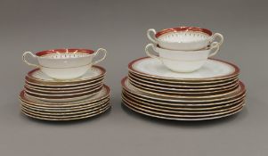 An Aynsley gilt and red heightened part dinner service.