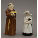 Two Royal Worcester porcelain candle snuffers, one formed as a monk, the other a nun.
