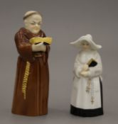 Two Royal Worcester porcelain candle snuffers, one formed as a monk, the other a nun.