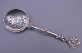 A silver sifting spoon. 16 cm long. 37.7 grammes.