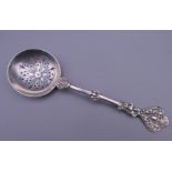 A silver sifting spoon. 16 cm long. 37.7 grammes.