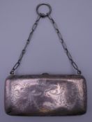 A silver chaste purse. 11 cm wide.