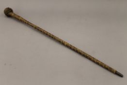 A 19th century sailors knot walking stick. 89 cm long.