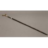 A ladies gilt mounted partridge wood walking stick. 89 cm long.