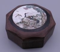 A wood and mother-of-pearl box decorated with cranes. 6.5 cm wide.