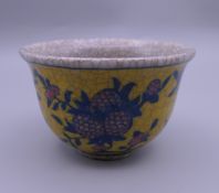 A Chinese yellow porcelain tea bowl. 6 cm high.