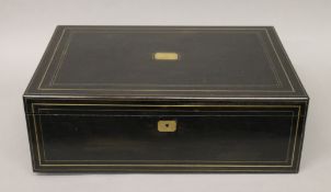 A large 19th century brass inlaid ebonised box. 59 cm wide.