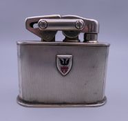 A Continental 830 silver clad table lighter. 7.5 cm high.