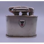 A Continental 830 silver clad table lighter. 7.5 cm high.