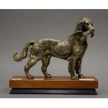 An early 20th century silvered pewter sculpture of a hunting dog with a pheasant,