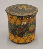 A painted papier mache tea caddy. 11.5 cm high.