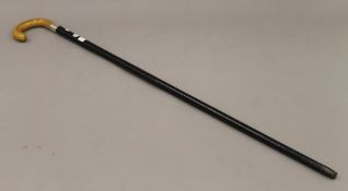 An Art Deco silver mounted walking stick, possibly with phenolic handle. 92 cm long.