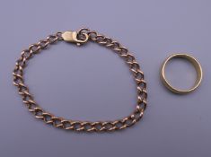 An 18 ct gold wedding band (5.8 grammes) and a 9 ct gold bracelet (11.1 grammes).