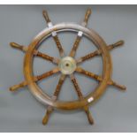 A wooden ship's wheel. 93 cm diameter overall.