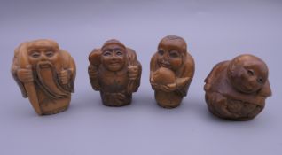 Four carved netsuke. Each approximately 3.5 cm high.