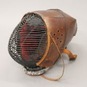A leather covered WWI sabre training helmet. 28 cm high.