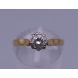 An 18 ct gold 1/4 carat diamond solitaire ring. Ring size K. 2.7 grammes total weight.