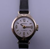 A 9 ct gold vintage Regency 17 jewel ladies wristwatch on a leather strap,