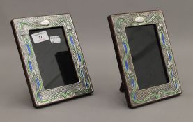 A pair of Art Nouveau style silver photograph frames. 19 cm high.