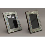 A pair of Art Nouveau style silver photograph frames. 19 cm high.