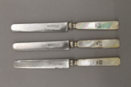Three 19th century mother-of-pearl handled knives, each bearing coronet. 19.5 cm long.
