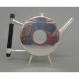 A Christopher Dresser style teapot. 14 cm high.