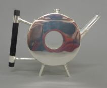 A Christopher Dresser style teapot. 14 cm high.