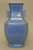 A Chinese blue porcelain arrow vase. 37 cm high.