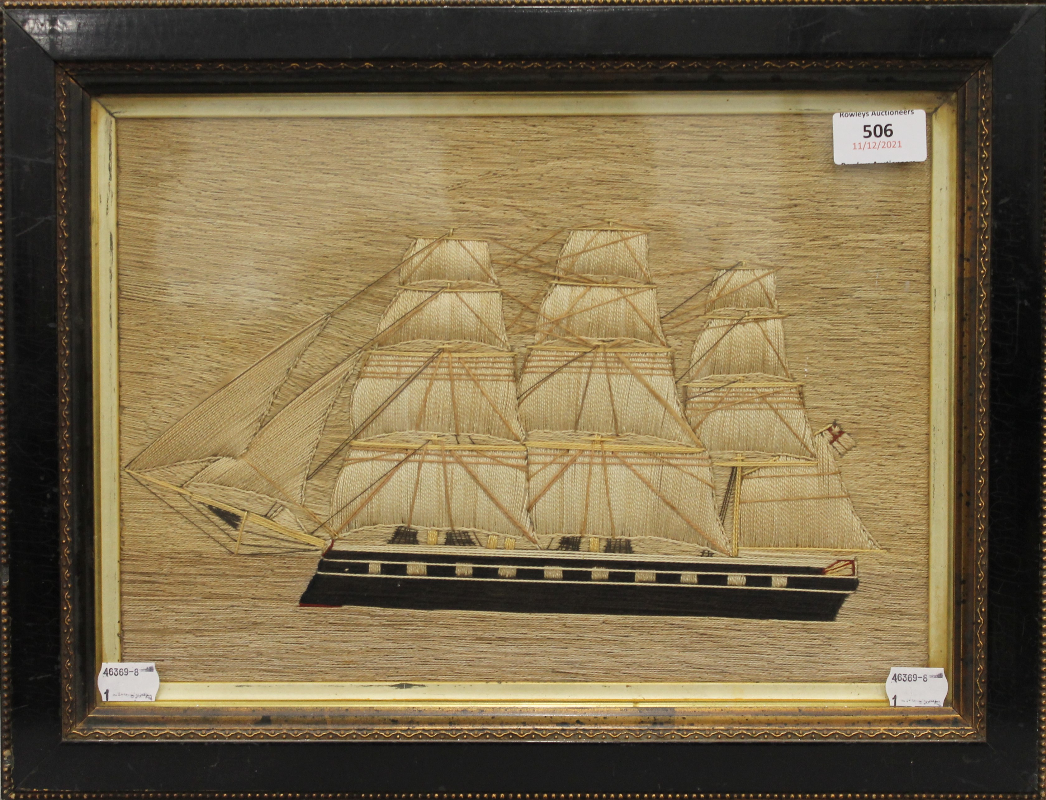 An antique sailors woolwork picture of a Sailing Ship, framed and glazed. 43 x 33 cm overall. - Image 2 of 2