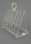 A silver plated gun form toast rack. 20 cm long.