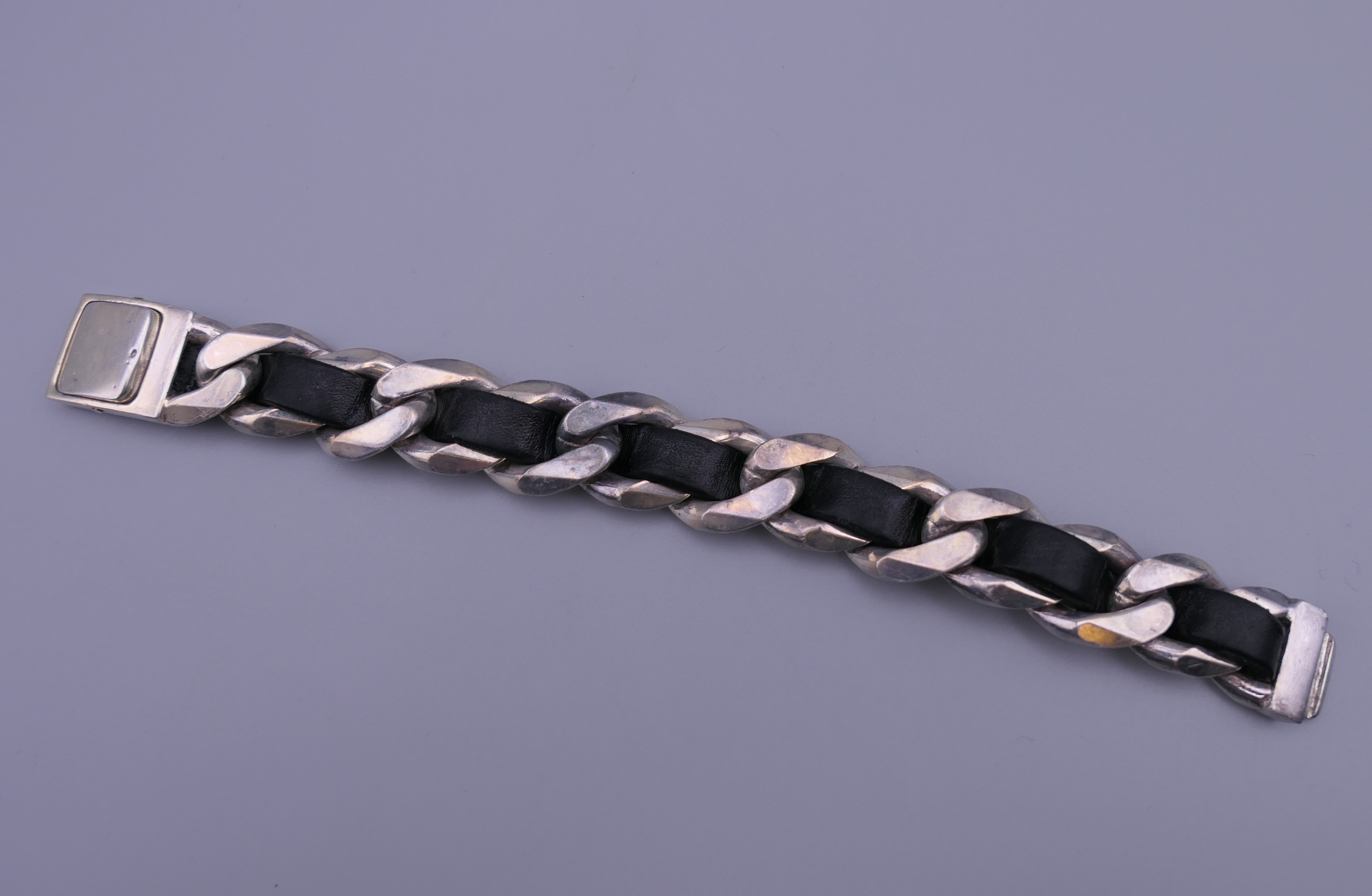 A silver and black leather bracelet. - Image 3 of 4