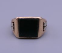 A 9 ct gold blood stone signet ring. Ring size L/M. 6.9 grammes total weight.