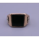 A 9 ct gold blood stone signet ring. Ring size L/M. 6.9 grammes total weight.