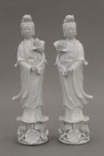 A pair of Chinese porcelain Republic Period figures of Guanyin. 30 cm high.